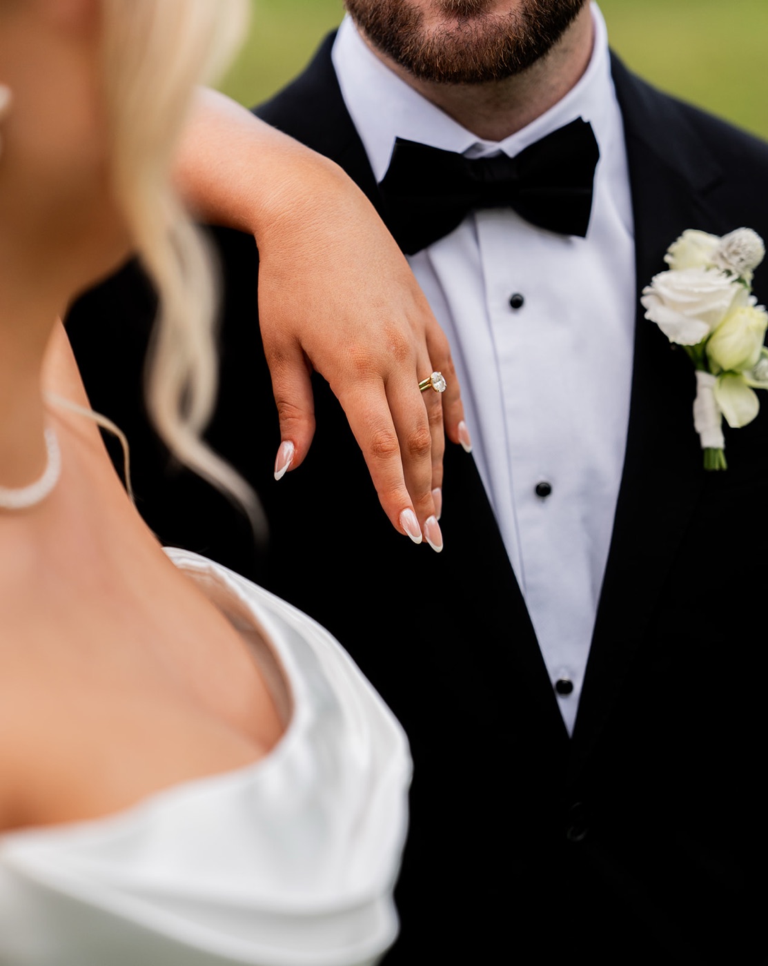 Hand resting on the groom's lapel